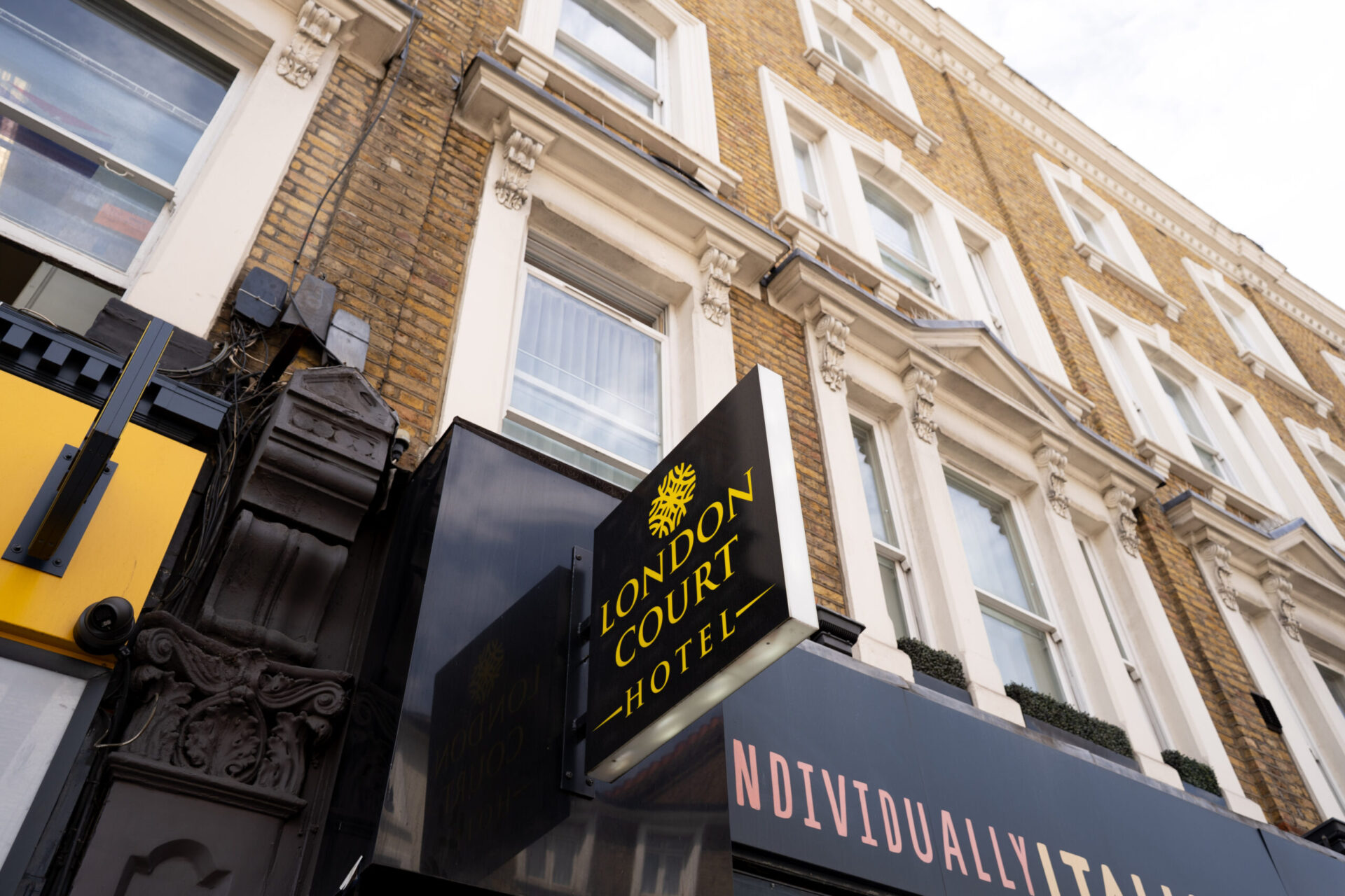 London Court Hotel sign on the Victorian building at 194–196 Earls Court Road