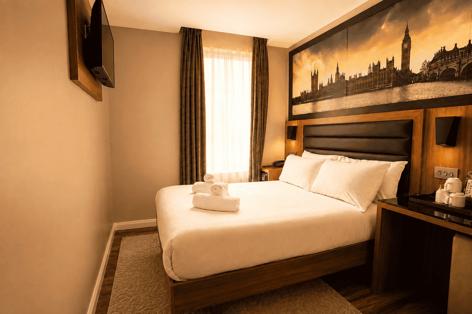 Double bed and window in the Classic Double Room, London Court Hotel Earl's Court